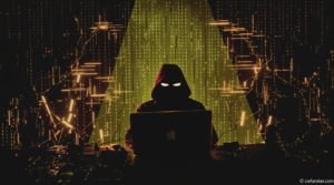 Hacker encapuchonné devant un ordinateur – Illustration de la cybersécurité et des menaces numériques